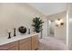 Bright hallway with built-in cabinets and a decorative display, leading to other rooms at 4131 E Cascalote Dr, Cave Creek, AZ 85331