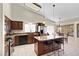 Bright kitchen with stone countertops, stainless appliances, and an island with barstool seating at 4131 E Cascalote Dr, Cave Creek, AZ 85331
