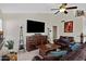 Comfortable living room with large screen television, stylish decor, and leather furniture at 4131 E Cascalote Dr, Cave Creek, AZ 85331
