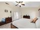 Relaxing main bedroom with a comfortable queen bed, neutral tones, and a ceiling fan at 4131 E Cascalote Dr, Cave Creek, AZ 85331