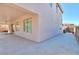 Exterior of the home showing the covered patio and well-manicured backyard at 43561 W Snow Dr, Maricopa, AZ 85138