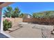 Backyard featuring brick pavers, rock landscaping, horseshoe pits, and desert foliage at 43561 W Snow Dr, Maricopa, AZ 85138