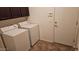 Featuring a laundry room with appliances and cabinets at 43561 W Snow Dr, Maricopa, AZ 85138