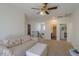 Spacious living area with staircase and doorways leading to other rooms of the house at 43561 W Snow Dr, Maricopa, AZ 85138