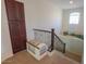Cozy loft area with carpet flooring and natural light from window at 43561 W Snow Dr, Maricopa, AZ 85138