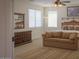 Primary bedroom with large windows, a ceiling fan, and ample space for relaxation at 43561 W Snow Dr, Maricopa, AZ 85138
