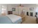 This primary suite has carpeted floors and includes a sitting area and en-suite bathroom at 43561 W Snow Dr, Maricopa, AZ 85138