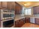 Well-appointed kitchen with stainless steel appliances, granite countertops, and stylish backsplash at 4410 E Robin Ln, Phoenix, AZ 85050