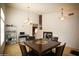 Spacious dining area adjacent to the stairway with neutral colors and lots of space at 44865 W Woody Rd, Maricopa, AZ 85139