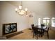 Dining room featuring tile and carpet flooring, neutral paint, and chandelier at 44865 W Woody Rd, Maricopa, AZ 85139