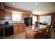 Kitchen with stainless steel appliances, ample counter space and breakfast bar seating at 44865 W Woody Rd, Maricopa, AZ 85139