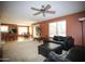 Open concept layout with living room flowing into dining area and kitchen, perfect for entertaining at 44865 W Woody Rd, Maricopa, AZ 85139