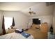 Spacious main bedroom features vaulted ceilings, ceiling fan, and generous layout at 44865 W Woody Rd, Maricopa, AZ 85139