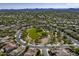 An aerial view showcases a meticulously planned community with parks, green spaces, streets, and custom single-Gathering homes at 5434 E Barwick Dr, Cave Creek, AZ 85331