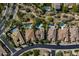 Aerial view showcasing homes with pools, well-maintained landscaping, and the serene neighborhood street at 5434 E Barwick Dr, Cave Creek, AZ 85331