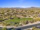 Scenic aerial of community featuring the playground, desert landscape and mountain views at 5434 E Barwick Dr, Cave Creek, AZ 85331
