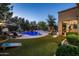 Backyard features a pool, seating, and games at 5434 E Barwick Dr, Cave Creek, AZ 85331