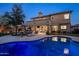 Inviting backyard with a pool, fire pit, and covered patio perfect for entertaining at 5434 E Barwick Dr, Cave Creek, AZ 85331