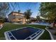 Expansive backyard featuring a trampoline, putting green, pool and spa at 5434 E Barwick Dr, Cave Creek, AZ 85331