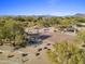Aerial view of basketball court surrounded by desert landscaping with a covered seating area at 5434 E Barwick Dr, Cave Creek, AZ 85331