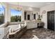 Bathroom with large soaking tub, tiled floors, and dual vanities at 5434 E Barwick Dr, Cave Creek, AZ 85331