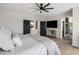 Bedroom with hardwood floors, ceiling fan, and an attached bathroom at 5434 E Barwick Dr, Cave Creek, AZ 85331