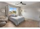 Light and bright bedroom with plank accent wall and wood floors at 5434 E Barwick Dr, Cave Creek, AZ 85331