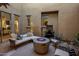 Outdoor courtyard featuring a fire pit, water fountain, and comfortable seating area at 5434 E Barwick Dr, Cave Creek, AZ 85331