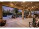Spacious covered patio with ample seating, outdoor kitchen, and views of the backyard at 5434 E Barwick Dr, Cave Creek, AZ 85331