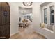 Elegant foyer featuring a curved window seat and views of the dining area and staircase at 5434 E Barwick Dr, Cave Creek, AZ 85331