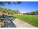View of landscaped green space with a bench to sit and enjoy the outdoors at 5434 E Barwick Dr, Cave Creek, AZ 85331