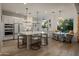 Open-concept kitchen with a large island, pendant lighting, and a cozy breakfast nook by the window at 5434 E Barwick Dr, Cave Creek, AZ 85331