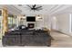 Stylish living room featuring a cozy fireplace, a large sectional sofa, and plenty of natural light at 5434 E Barwick Dr, Cave Creek, AZ 85331