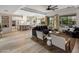 Open-concept living room featuring a large sectional sofa, modern furnishings, and a view to the outdoor pool at 5434 E Barwick Dr, Cave Creek, AZ 85331