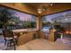 Well-equipped outdoor kitchen under a covered patio, ideal for summer barbecues at 5434 E Barwick Dr, Cave Creek, AZ 85331