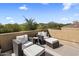 Outdoor patio with cozy seating, a privacy wall, and a desert view at 5434 E Barwick Dr, Cave Creek, AZ 85331