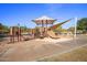 Community playground with slides, climbing structures and sun shades providing fun for all ages at 5434 E Barwick Dr, Cave Creek, AZ 85331