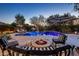Outdoor pool with seating and fire pit with well manicured desert landscaping at 5434 E Barwick Dr, Cave Creek, AZ 85331