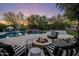 Backyard oasis featuring a pool, spa, fire pit, lounge seating, and privacy landscaping at 5434 E Barwick Dr, Cave Creek, AZ 85331