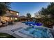 Backyard pool and hot tub with desert landscaping, well appointed seating and a waterfall at 5434 E Barwick Dr, Cave Creek, AZ 85331