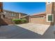 Spacious backyard features a large concrete area and a detached garage, perfect for outdoor activities at 5707 N Kristi Ln, Litchfield Park, AZ 85340