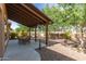 Tranquil backyard patio with mature trees at 5707 N Kristi Ln, Litchfield Park, AZ 85340