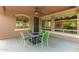 Inviting covered patio with a fire pit table and chairs, great for outdoor enjoyment at 5707 N Kristi Ln, Litchfield Park, AZ 85340