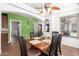 Dining room boasts a wood table, chairs, and bright light from nearby window at 5707 N Kristi Ln, Litchfield Park, AZ 85340