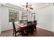Dining room featuring a wood table, comfortable seating, and natural light at 5707 N Kristi Ln, Litchfield Park, AZ 85340