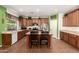 Lovely kitchen boasts custom cabinets, large island, stainless appliances, and tile floors at 5707 N Kristi Ln, Litchfield Park, AZ 85340