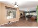 Open concept living space with tile floors and living room views at 5707 N Kristi Ln, Litchfield Park, AZ 85340
