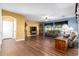 Bright living room with wood laminate flooring, a ceiling fan, and a neutral color palette at 5707 N Kristi Ln, Litchfield Park, AZ 85340