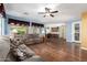 Inviting living room with wood floors, sofa, and natural light at 5707 N Kristi Ln, Litchfield Park, AZ 85340