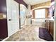 Main bathroom features tile floors, large soaking tub, a shower, and a double sink vanity at 5707 N Kristi Ln, Litchfield Park, AZ 85340